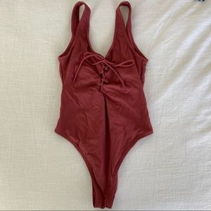 High-cut tie up one piece